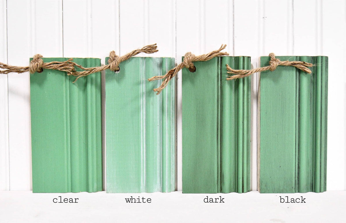 Four wood samples in Gumdrop by Sweet Pickins Milk Paint, tied together with twine.