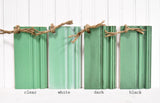 Four wood samples in Gumdrop by Sweet Pickins Milk Paint, tied together with twine.