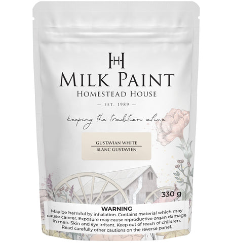 330g Homestead House Gustavian White Milk Paint with floral design and warning label at the bottom.