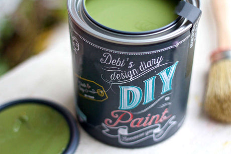 Open Gypsy Green DIY Paint can by DIY Paint Co. with lid and brush beside it.