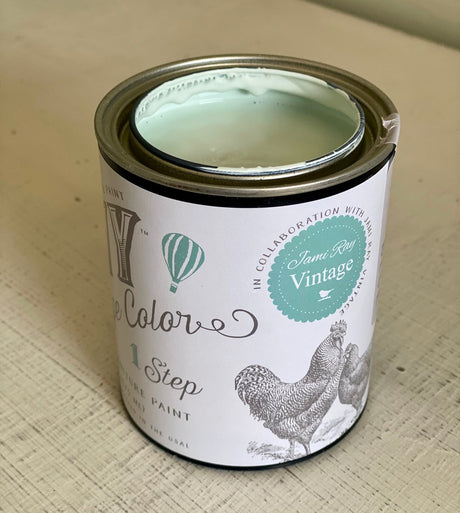 Open can of DIY Paint Co. Haint Blue Cottage Color, light mint green paint for wood surfaces.