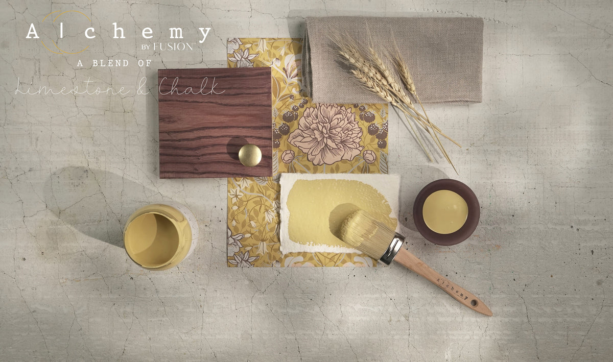 Wood sample, yellow floral tile, fabric swatch, and Fusion Mineral Paint Harvest arranged on a gray background.