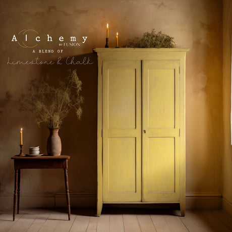Yellow wardrobe and table with candles against a beige wall painted in Harvest Alchemy by Fusion Mineral Paint.