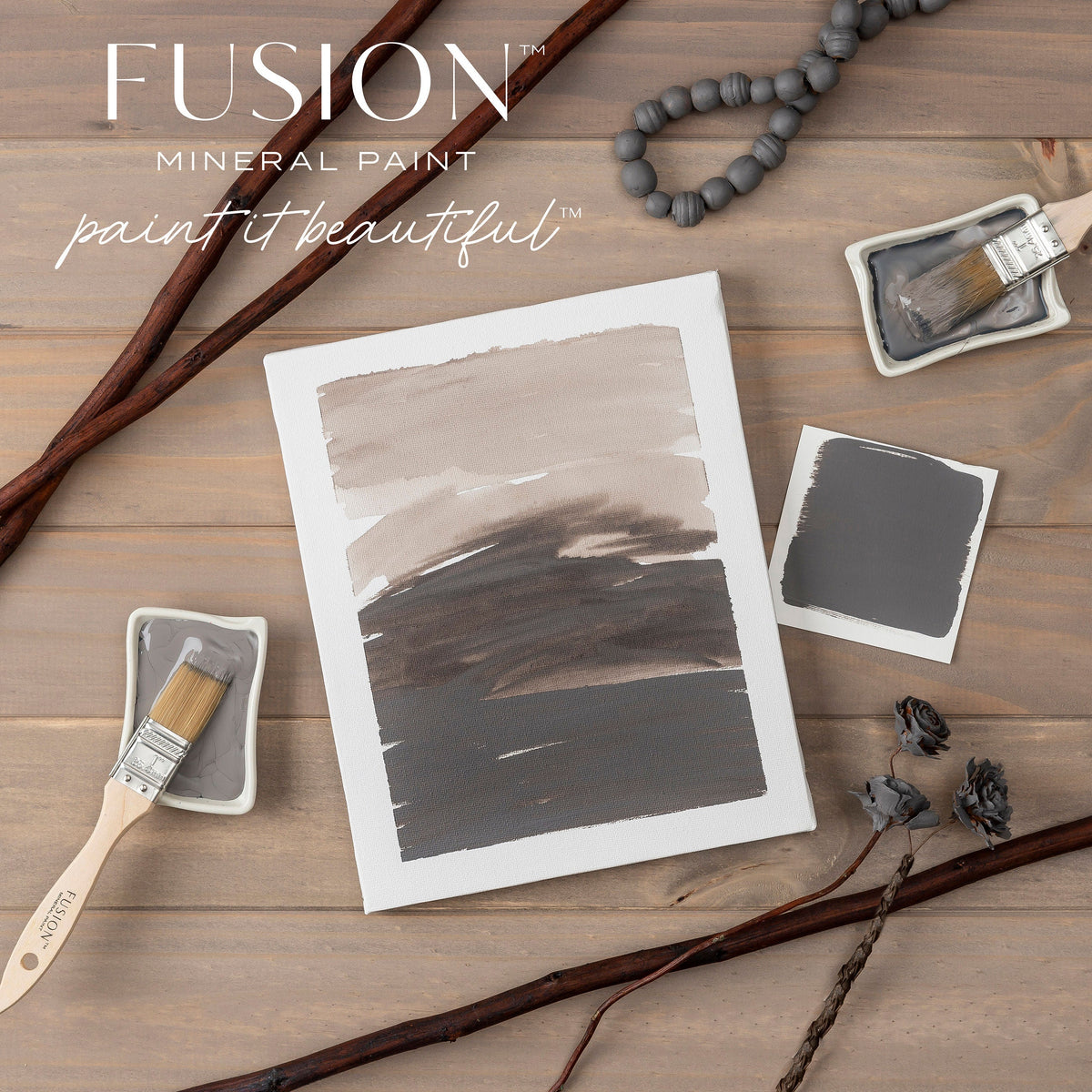Hazelwood Fusion Mineral Paint swatches with brushes, trays, and decor displayed on a wooden surface.