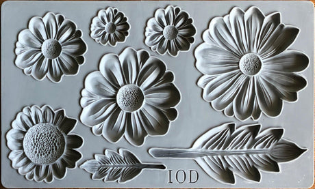 He Loves Me Mould by I.O.D. with daisy and leaf patterns, plus I.O.D. logo at the bottom.