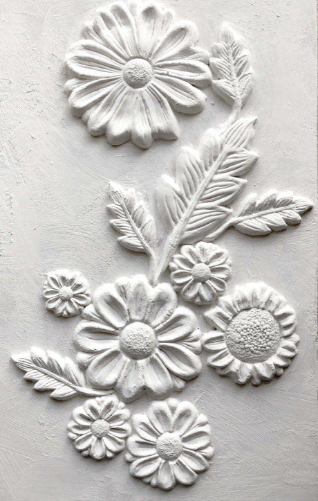 White daisy relief sculpture using He Loves Me Mould by IOD – Iron Orchid Designs.