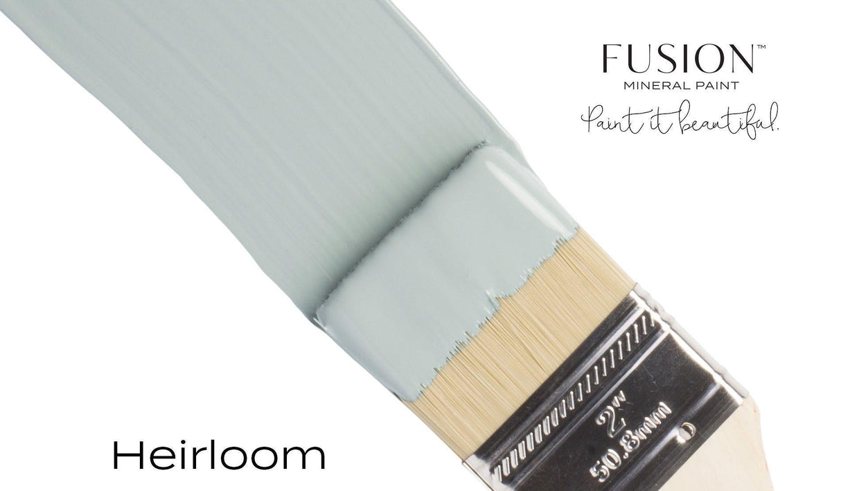 Brush with vintage blue Heirloom Fusion Mineral Paint (Seasonal), text reads: Paint it beautiful.