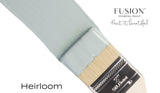 Brush with vintage blue Heirloom Fusion Mineral Paint (Seasonal), text reads: Paint it beautiful.
