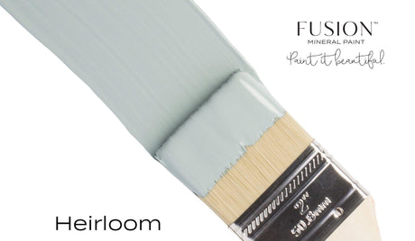 Brush with vintage blue Heirloom Fusion Mineral Paint (Seasonal), text reads: Paint it beautiful.