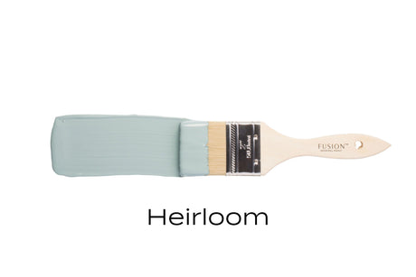 Paintbrush with light blue-green Heirloom Fusion Mineral Paint (Seasonal) by Fusion Mineral Paint on white background.