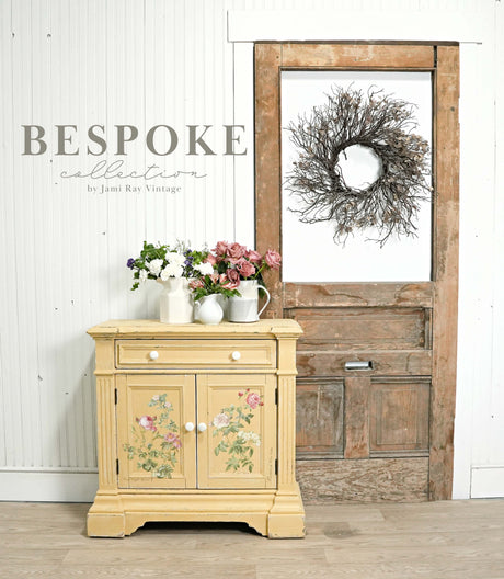 Yellow Hollandaise-painted cabinet by Old Fashioned Milk Paint, floral top, twig wreath, BESPOKE collection.