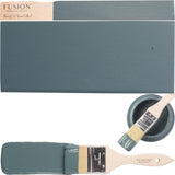 Fusion Mineral Paint Homestead Blue can, paintbrush with blue paint, and teal color swatch.