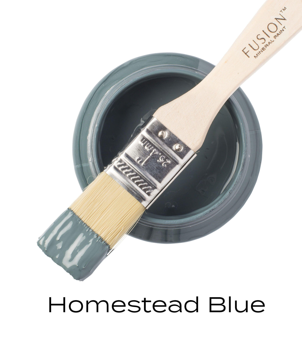 Open jar of Homestead Blue Fusion Mineral Paint with brush resting on top, all-in-one label visible.