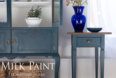 Blue side table, cabinet, vase, and bowl with “Homestead Blue Milk Paint by Homestead House” text.
