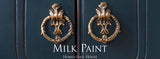 Two gold door knockers on a dark blue door finished in Homestead Blue Milk Paint by Homestead House.