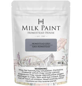 50g bag of Homestead House Homestead Grey Milk Paint with health warning displayed at the bottom of the packaging.