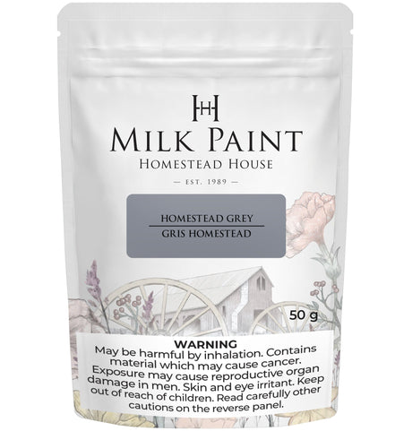 50g bag of Homestead House Homestead Grey Milk Paint with health warning displayed at the bottom of the packaging.