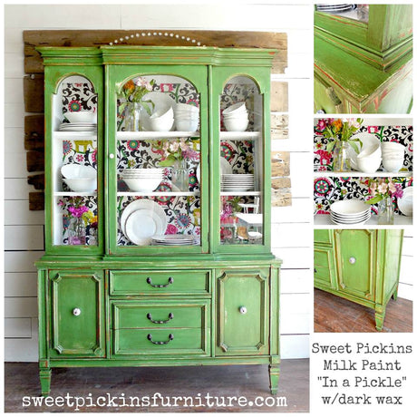 Green hutch with white dishes and “In A Pickle” by Old Fashioned Milk Paint info displayed.