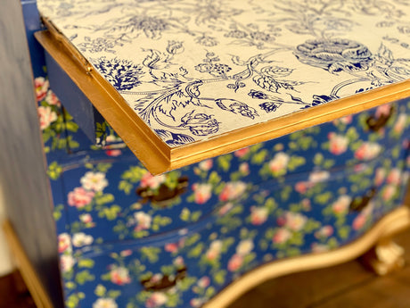 Blue dresser with I.O.D. Indigo Floral Paint Inlay and a white top featuring botanical motifs.