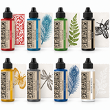 Eight Decor Ink by IOD bottles displayed in front of stamped images matching each ink color.