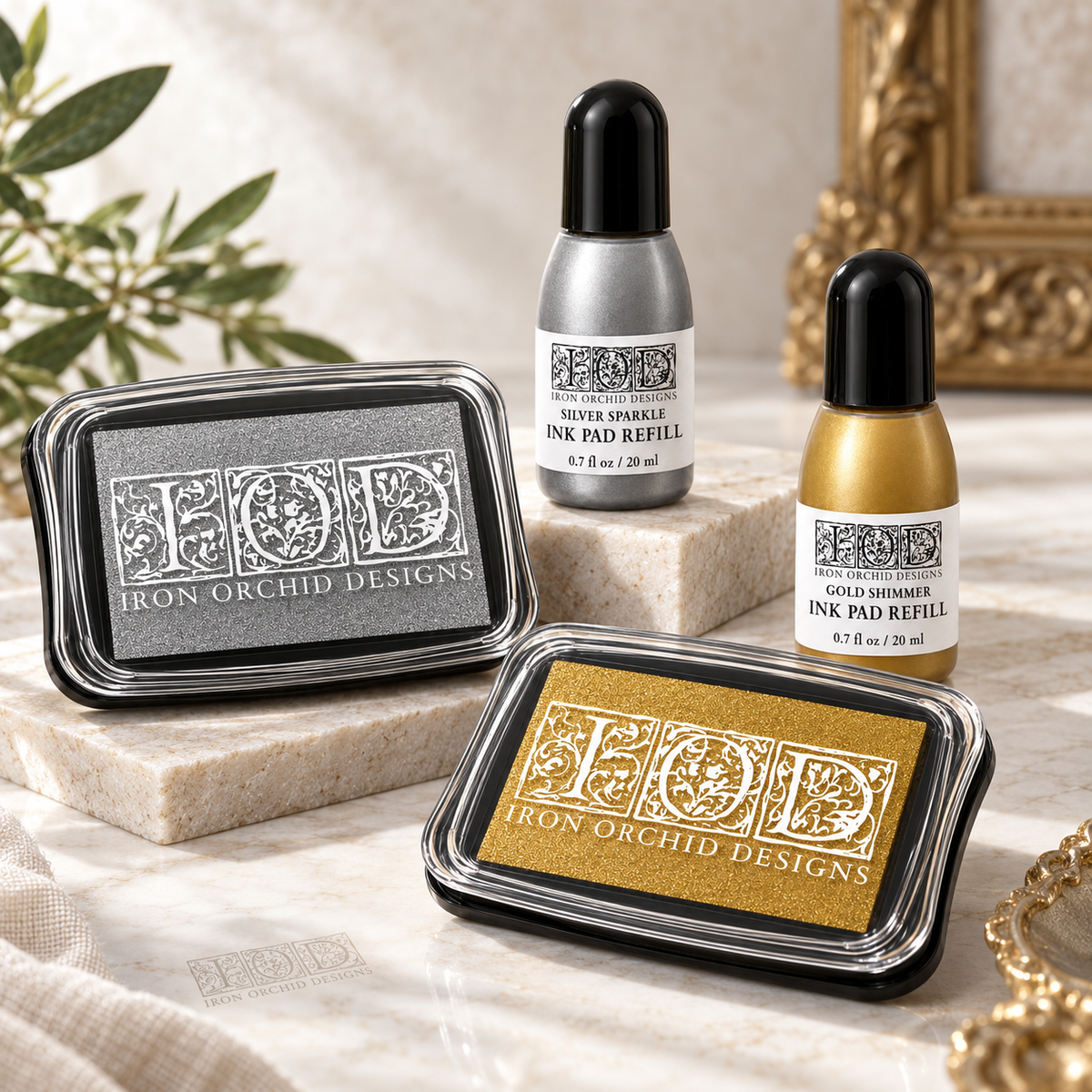 I.O.D. Metallic Ink Pads & Refills by Iron Orchid Designs in silver sparkle and gold shimmer.