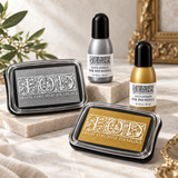 I.O.D. Metallic Ink Pads & Refills by Iron Orchid Designs in silver sparkle and gold shimmer.