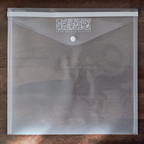 I.O.D. IOD Stamp Storage Envelope, clear plastic with button closure, for storing stamps.