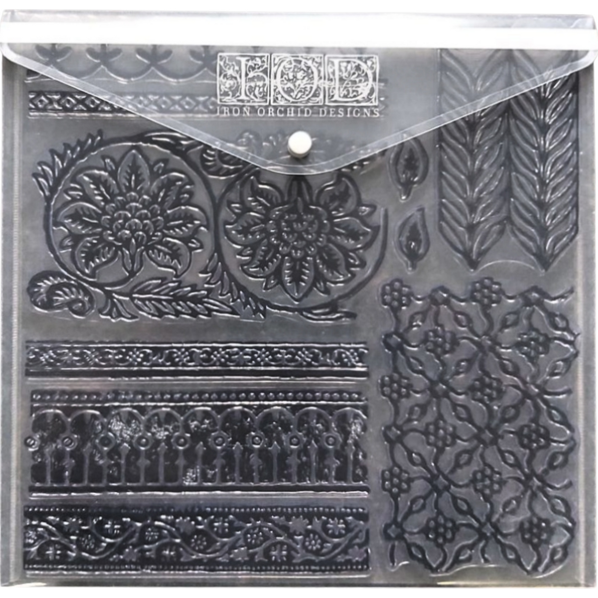 I.O.D. IOD Stamp Storage Envelope, clear plastic, with assorted black floral and geometric stamps.
