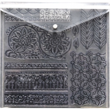 I.O.D. IOD Stamp Storage Envelope, clear plastic, with assorted black floral and geometric stamps.