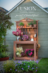 Potting bench with tools, flowers, and terracotta accents finished in Iron Clay Fusion Mineral Paint by Fusion Mineral Paint.