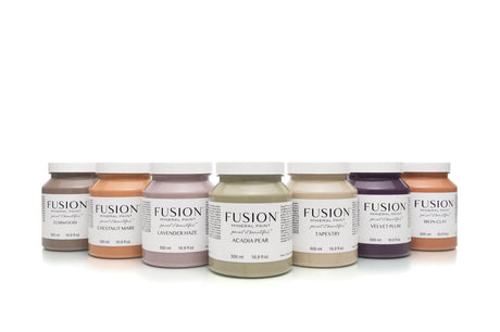 Seven Fusion Mineral Paint jars, including Iron Clay, arranged side by side.