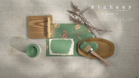 Alchemy by Fusion Digital Downloads with dried plants, paintbrush, and board arranged on a textured surface.