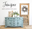 Sideboard painted in Juniper by Old Fashioned Milk Paint with vases and greenery displayed on top.