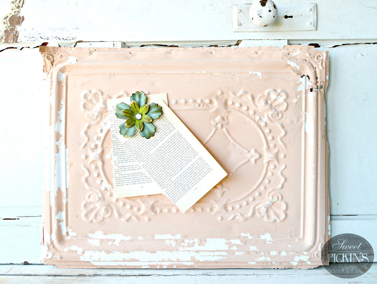Book page clipped with blue flower to pink ornate panel painted in Just Peachy by Old Fashioned Milk Paint.
