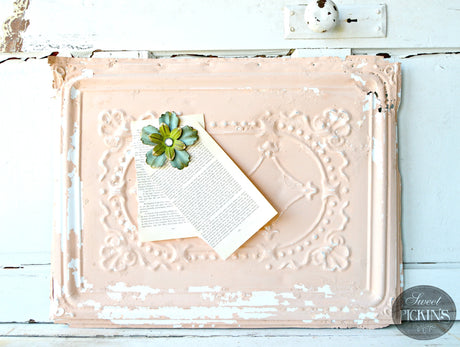 Book page clipped with blue flower to pink ornate panel painted in Just Peachy by Old Fashioned Milk Paint.