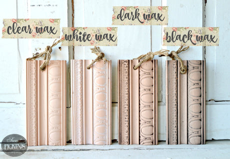 Four trim samples in Just Peachy by Old Fashioned Milk Paint: clear, white, dark, and black wax finishes with twine loops.