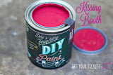 Open can of Kissing Booth DIY Paint by DIY Paint Co. on wood surface.