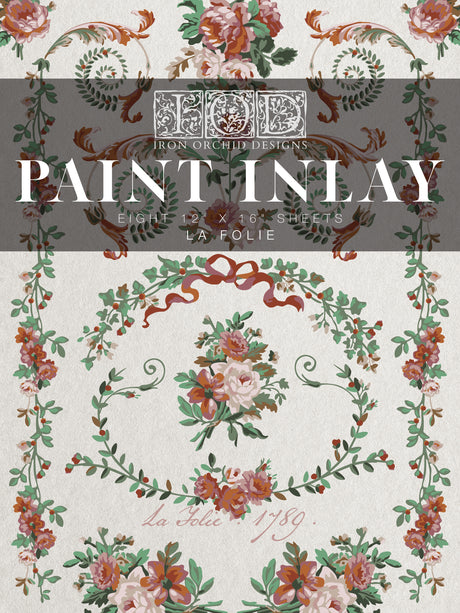 La Folie Paint Inlay 2025 by I.O.D.; French folk art style with floral scrolls, roses, leaves, and red ribbons.
