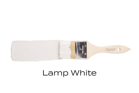 Fusion Mineral Paintbrush and Lamp White acrylic paint tube on a plain white background.
