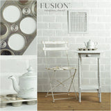 White chair and table painted in Lamp White Fusion Mineral Paint, with teapot and muffin tray nearby.