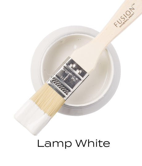 Brush resting on open jar of Fusion Mineral Paint Lamp White acrylic.