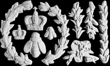 White carvings made with Laurel Mould by I.O.D. arranged on black background.