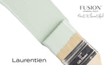 Paintbrush with Fusion Mineral Paint in Laurentien, a pale green seasonal color, from Fusion Mineral Paint.