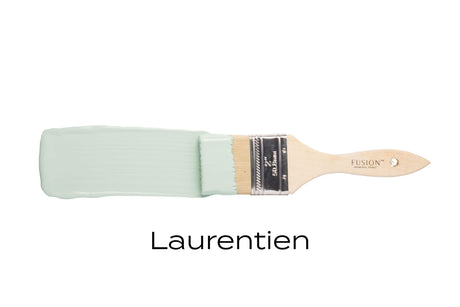 Paintbrush with pale green Laurentien Fusion Mineral Paint (Seasonal) by Fusion Mineral Paint on white.
