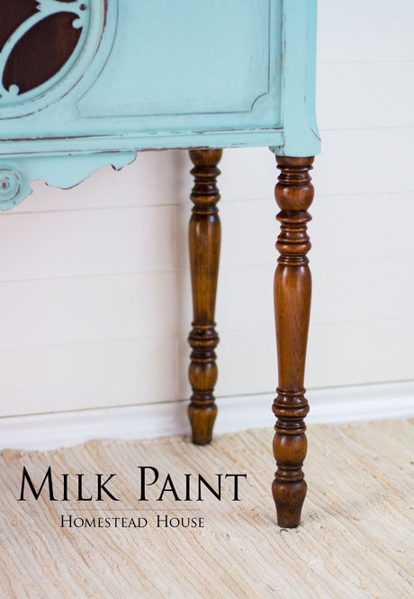 Turquoise Laurentien Milk Paint by Homestead House on furniture, displayed on a beige rug; text: Homestead House.