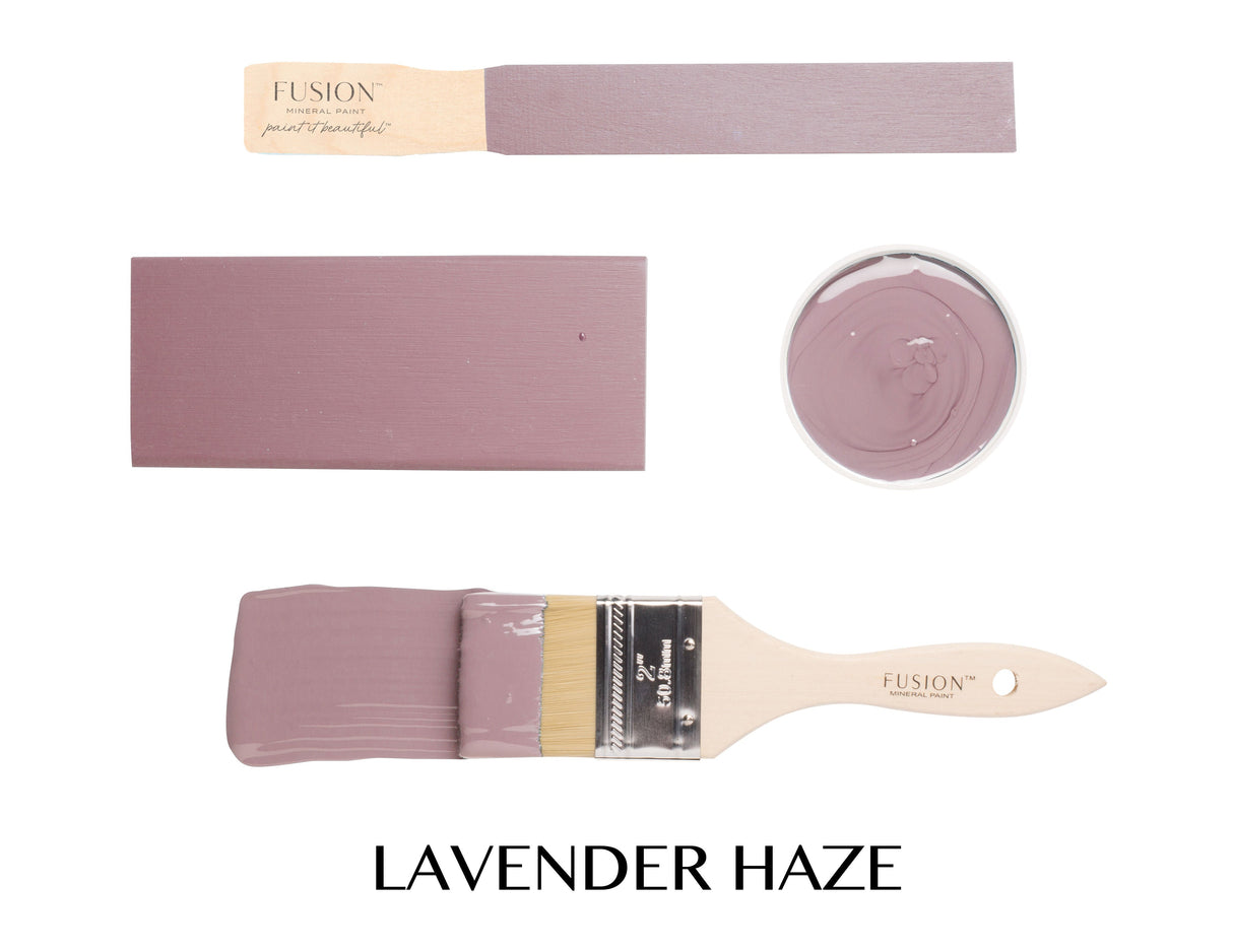 Lavender Haze Fusion Mineral Paint displayed on a brush, wood swatches, and an open container.