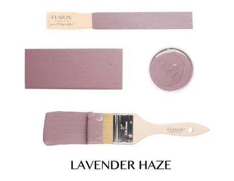 Lavender Haze Fusion Mineral Paint displayed on a brush, wood swatches, and an open container.