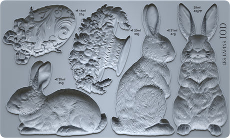Six Les Lapins moulds by I.O.D., vintage garden and French-inspired shapes, set of six.
