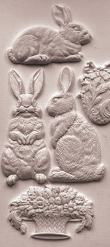 Les Lapins Mould by IOD with four embossed rabbits and a floral basket in vintage garden art style.