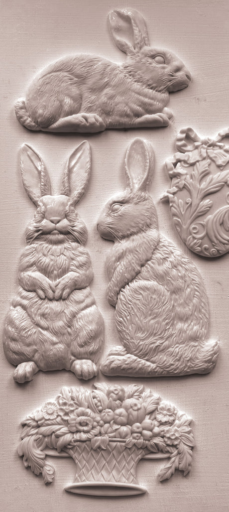 Les Lapins Mould by IOD with four embossed rabbits and a floral basket in vintage garden art style.